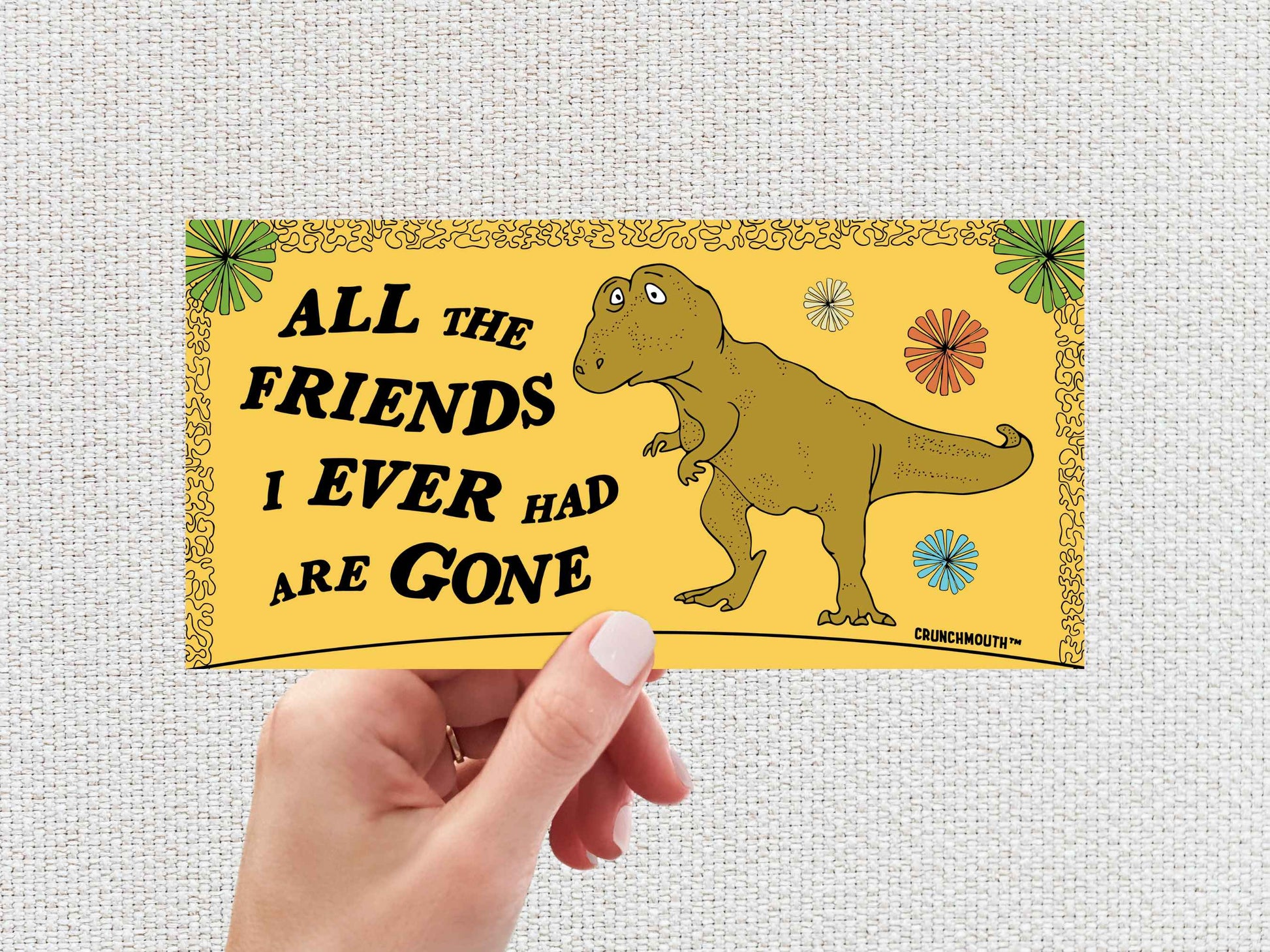 all the friends i ever had are gone bumper sticker, lonely t-rex, hand display, white textured background