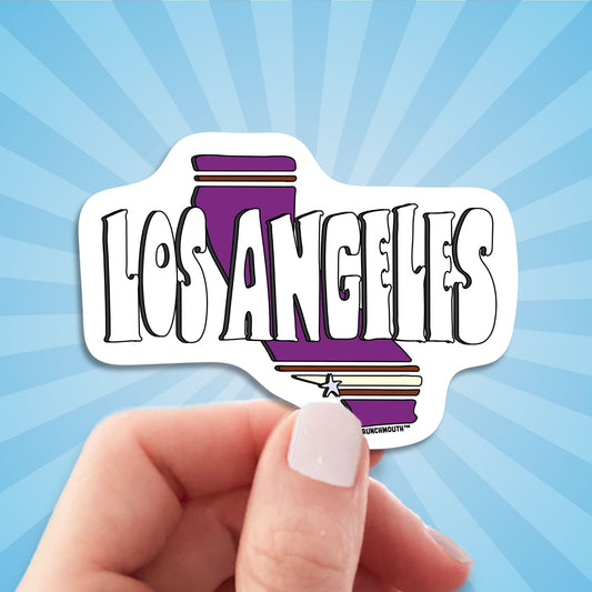 los angeles travel luggage sticker, hand display, sun rays design background
