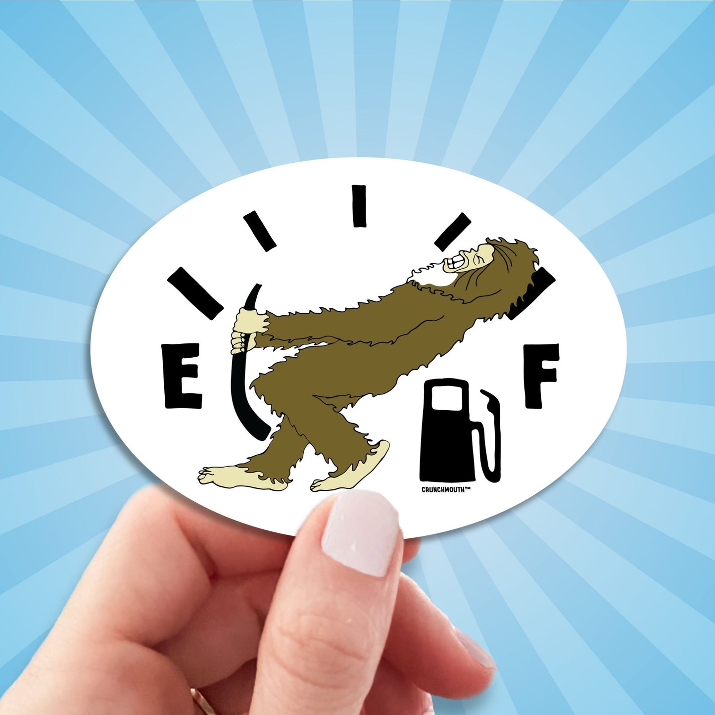 low fuel bigfoot sticker, hand display, sun rays design background
