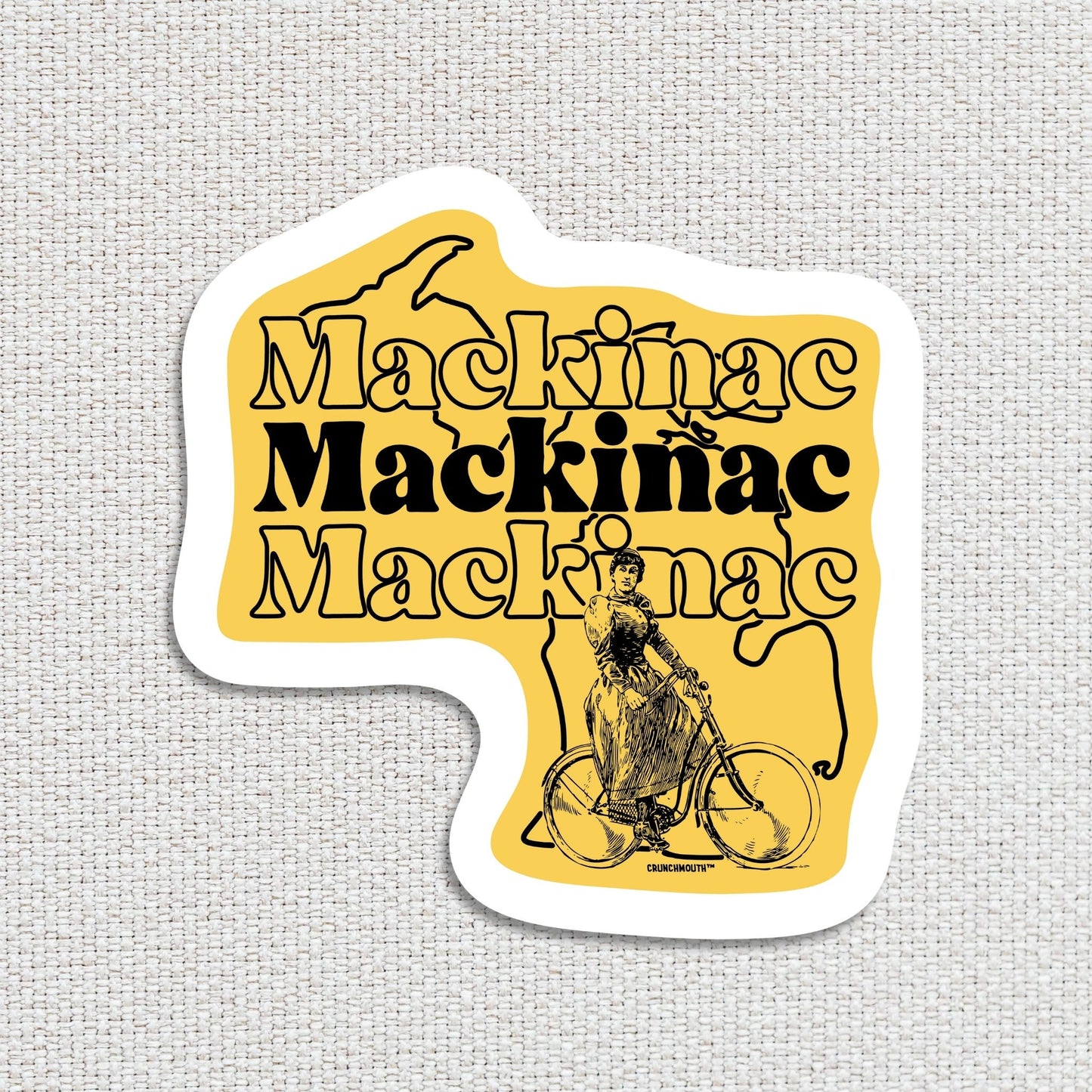 mackinac island Michigan travel luggage sticker, hand display, textured fabric background
