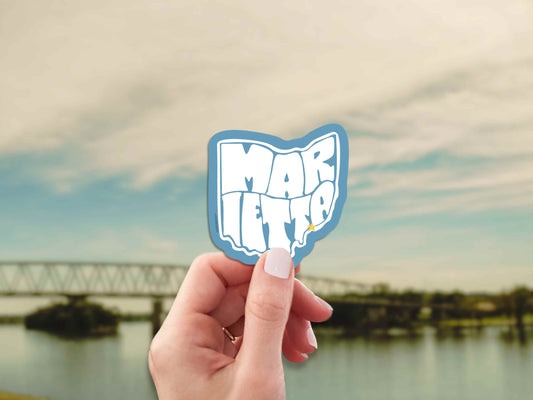marietta ohio travel luggage sticker, hand display, bridge over river landscape background