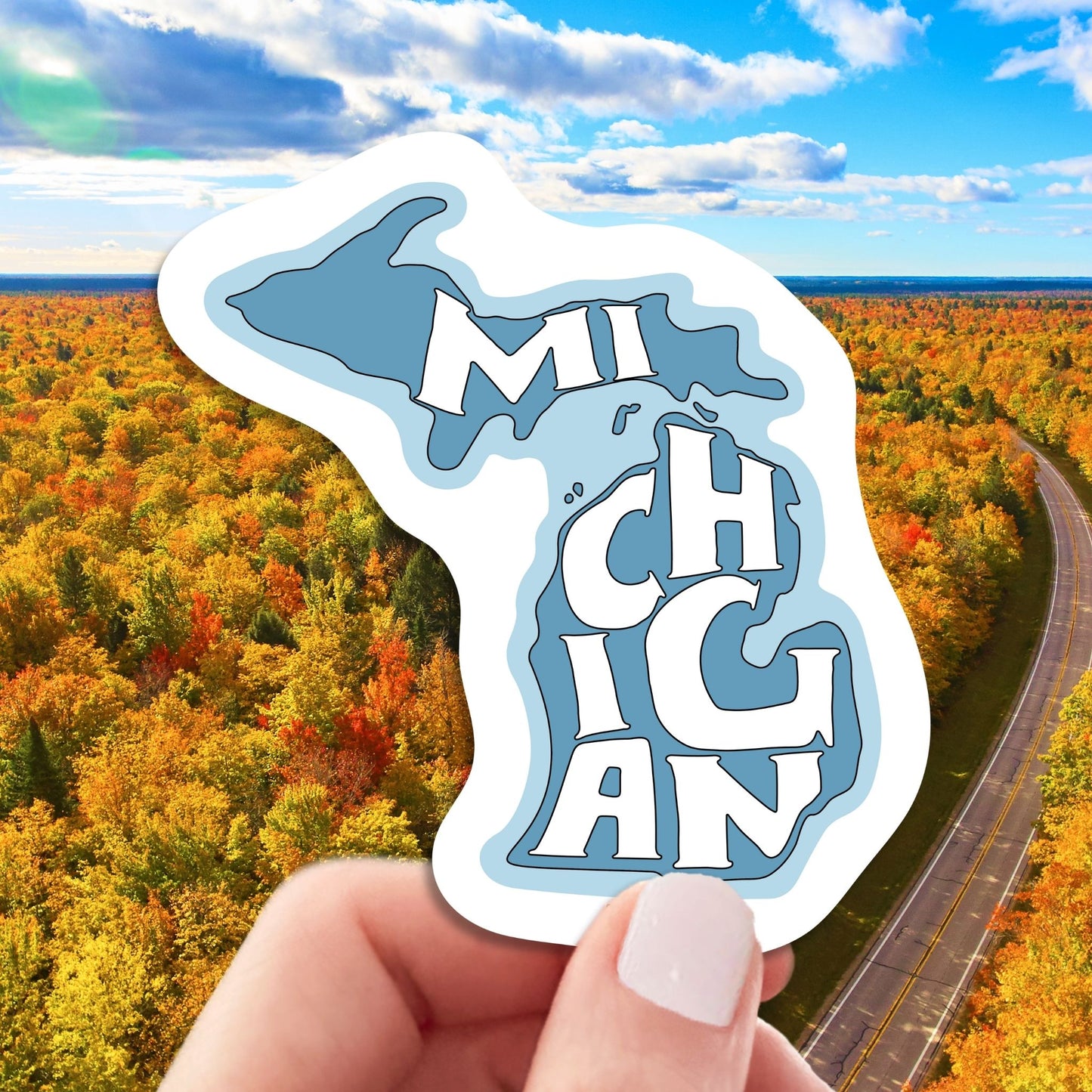 state of Michigan travel luggage sticker, hand display, pure Michigan background
