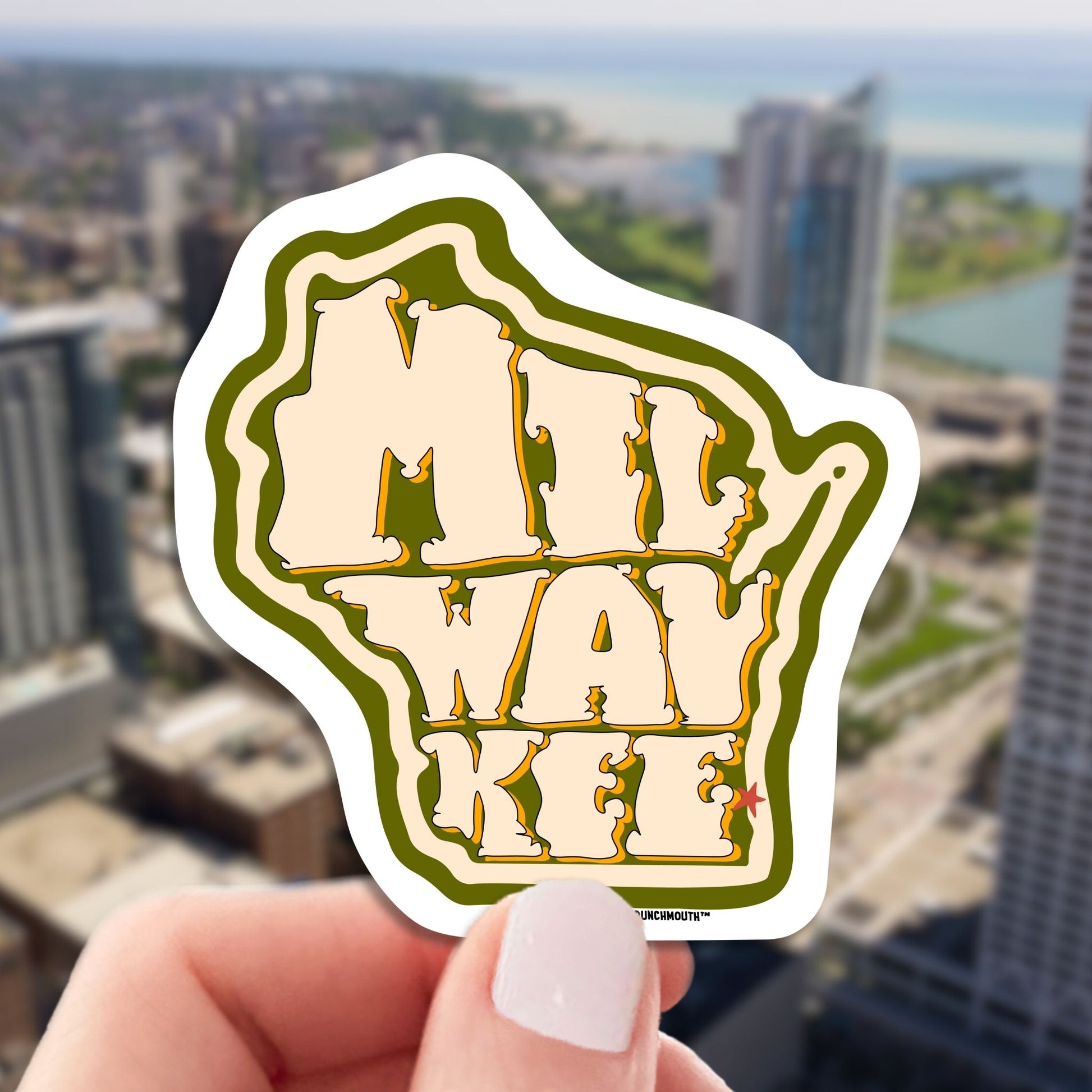 milwaukee travel luggage sticker, hand display, cityscape background