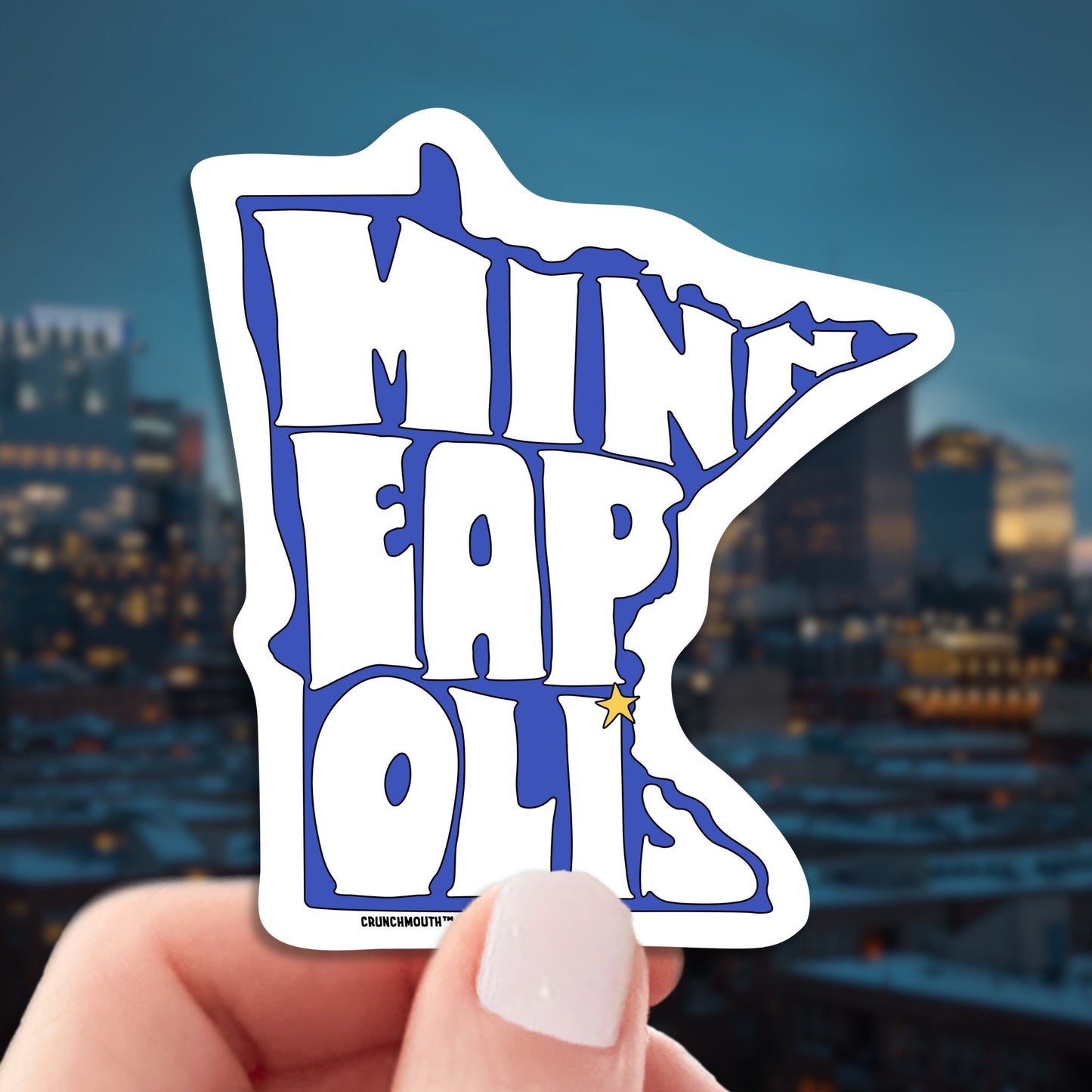 minneapolis travel luggage sticker, hand display, skyline background
