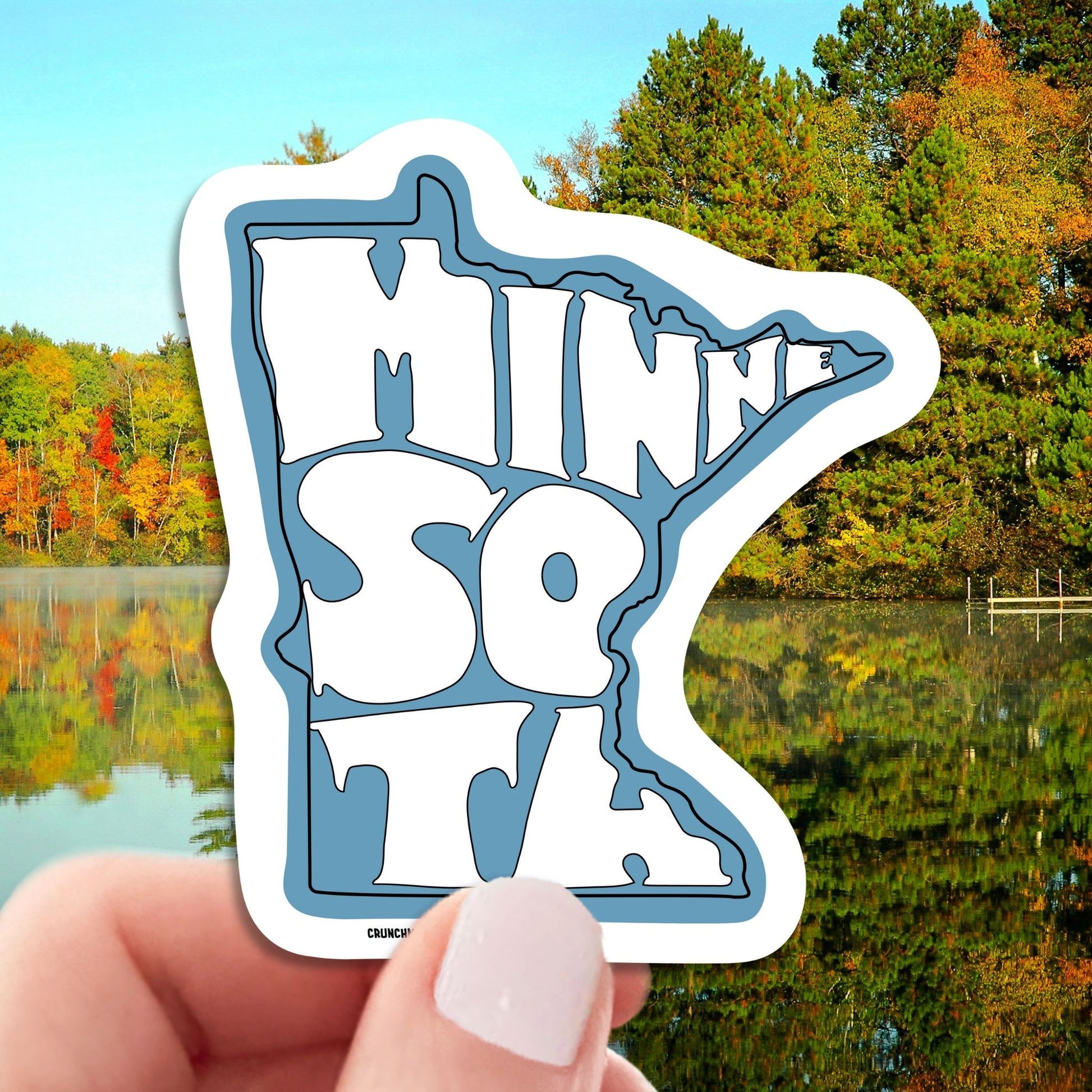 state of minnesota travel luggage sticker, hand display, nature background