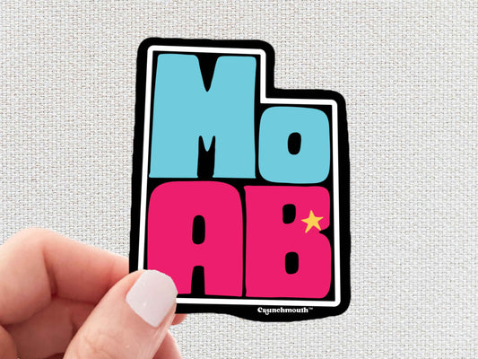 moab sticker, travel luggage stickers, hand display, white textured background