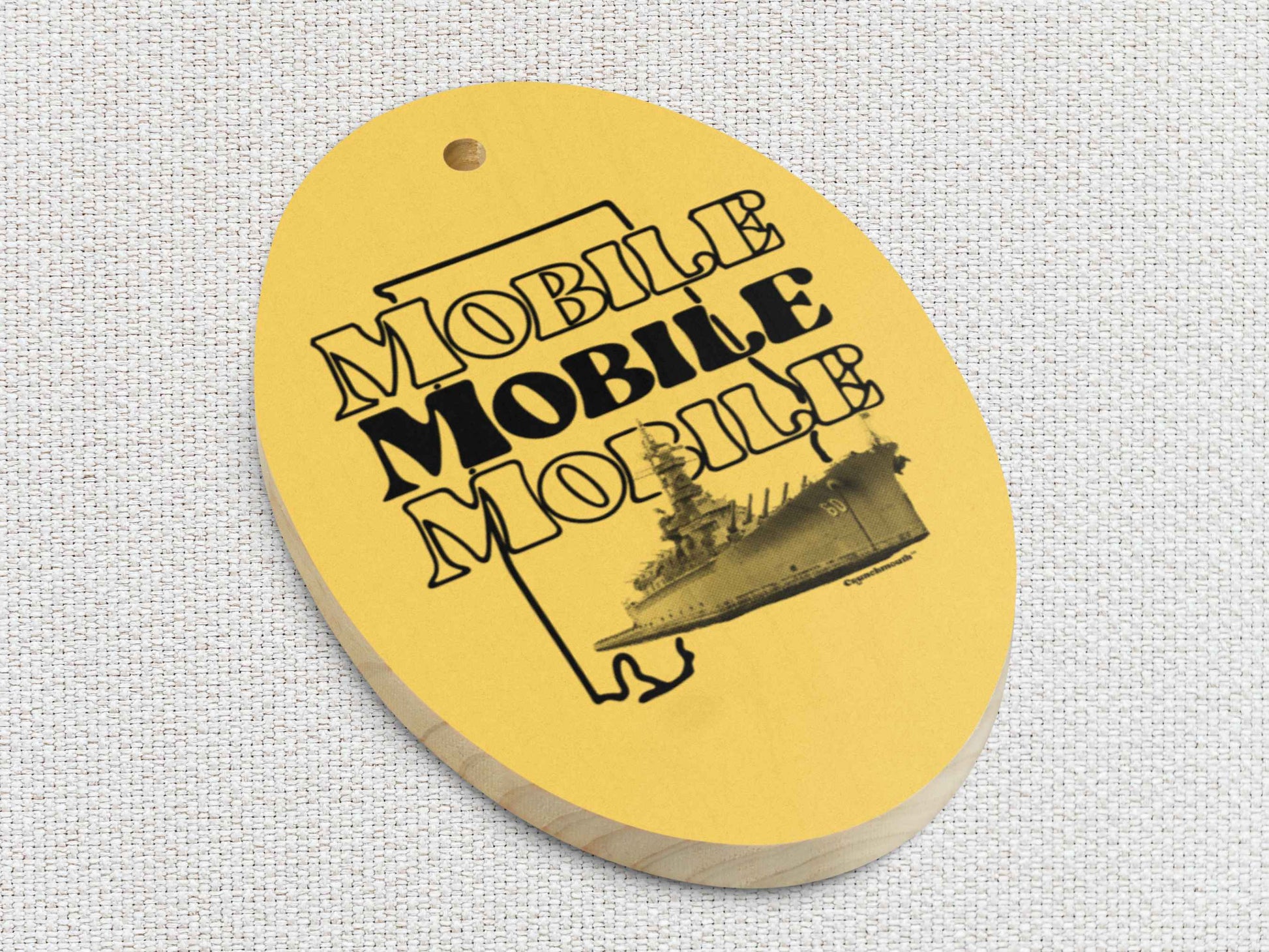 mobile Christmas ornament, uss alabama battleship, front bottom left side, white textured background