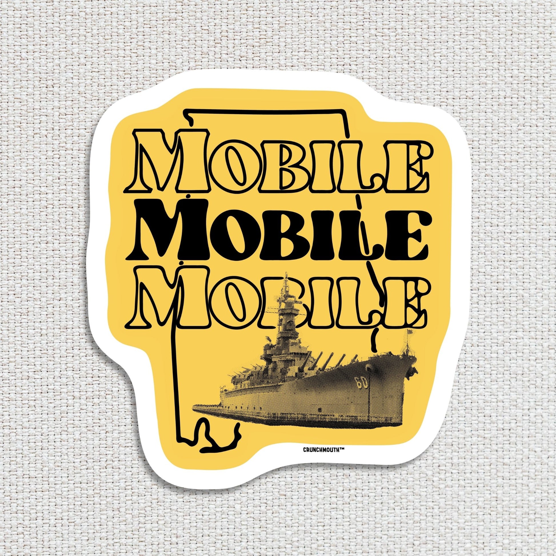 mobile alabama travel luggage sticker featuring uss alabama battleship, textured fabric background