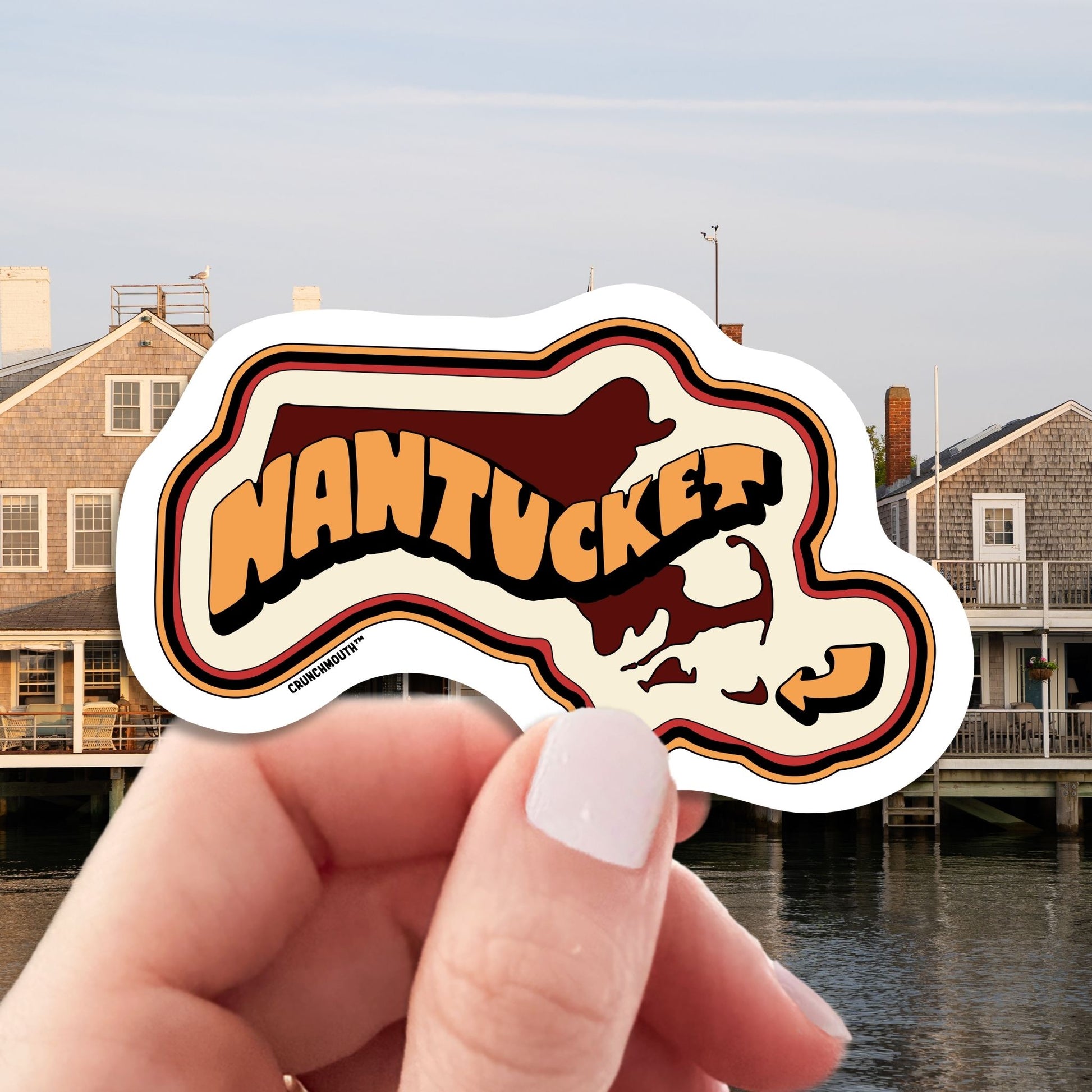 Nantucket island travel luggage sticker, hand display, nantucket background
