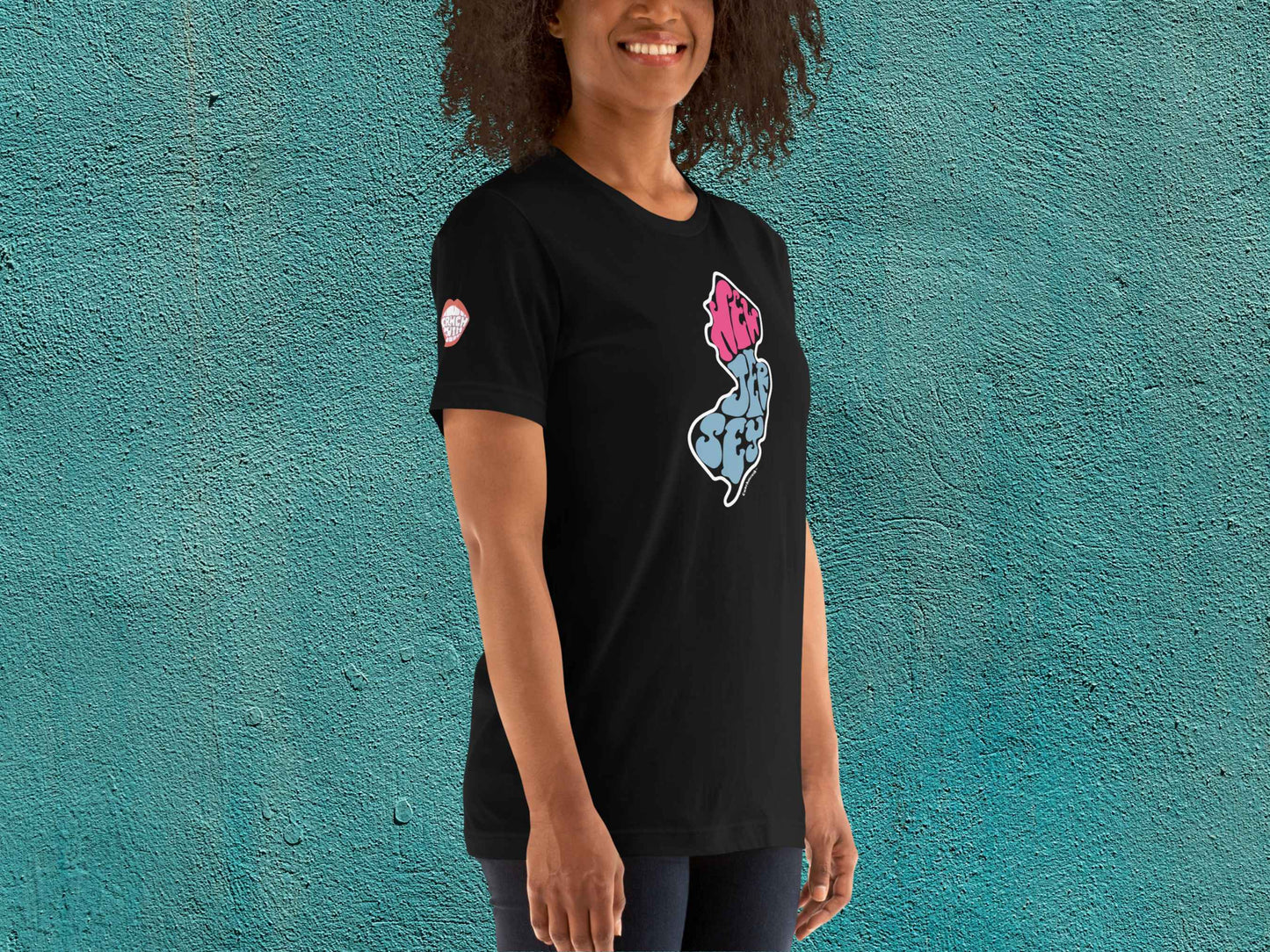 new jersey shirt, souvenir t shirts, female model, front right, teal textured background