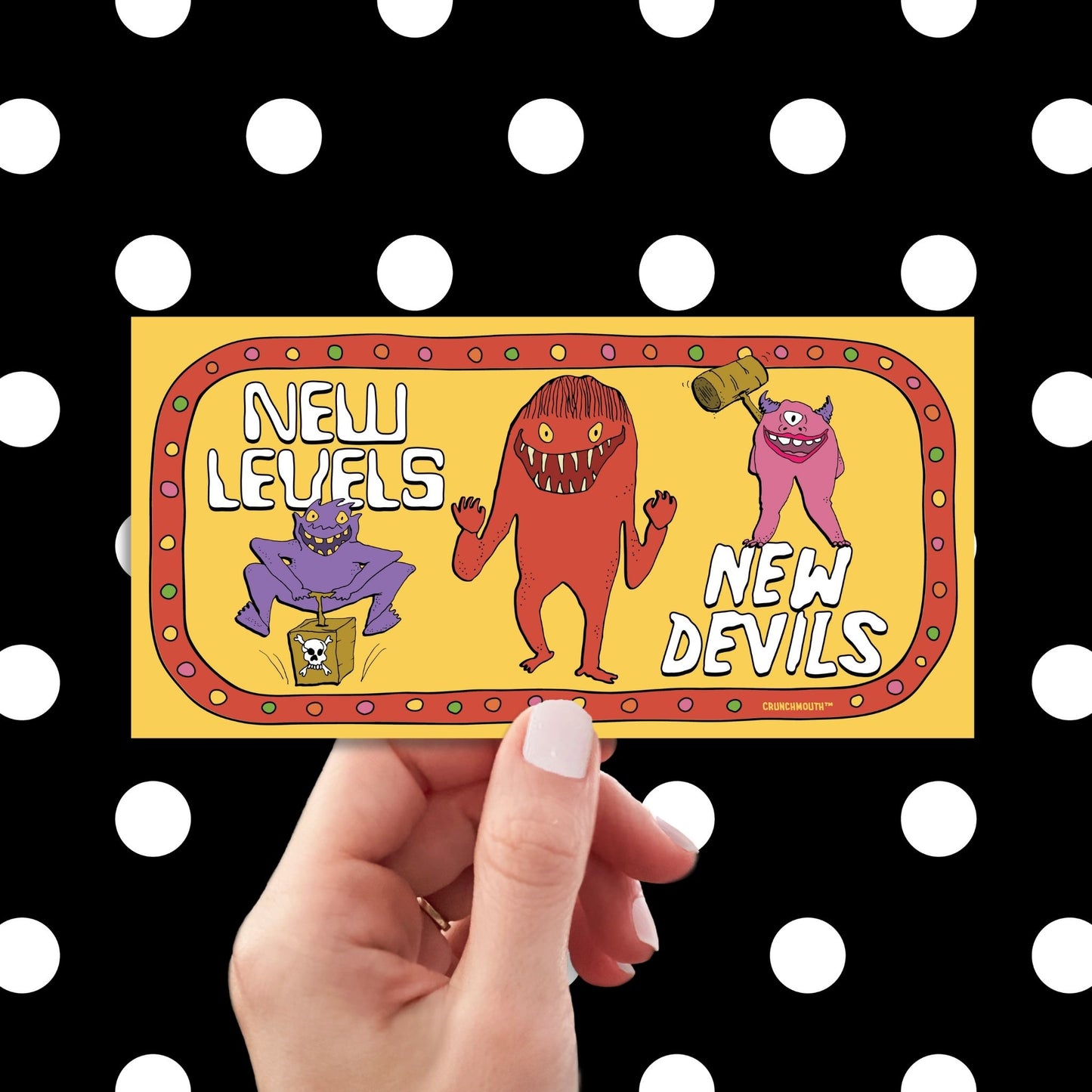 new levels new devils bumper sticker, hand display, polka dots pattern design background
