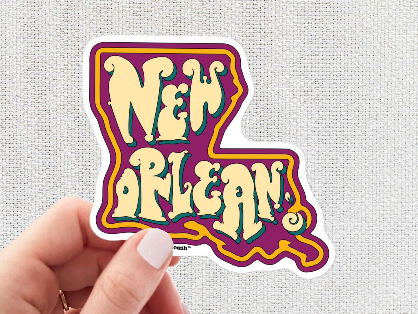 new orleans louisiana travel luggage sticker, hand display, white textured background