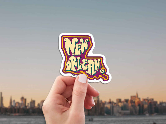 new orleans travel luggage sticker, hand display, city skyline background