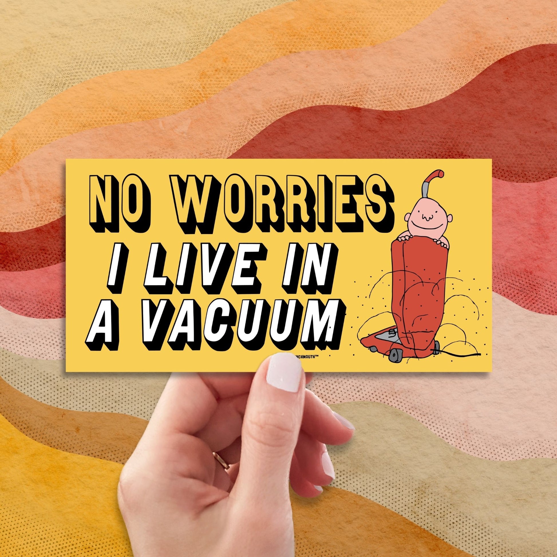 no worries i live in a vacuum bumper sticker, hand display, retro design background
