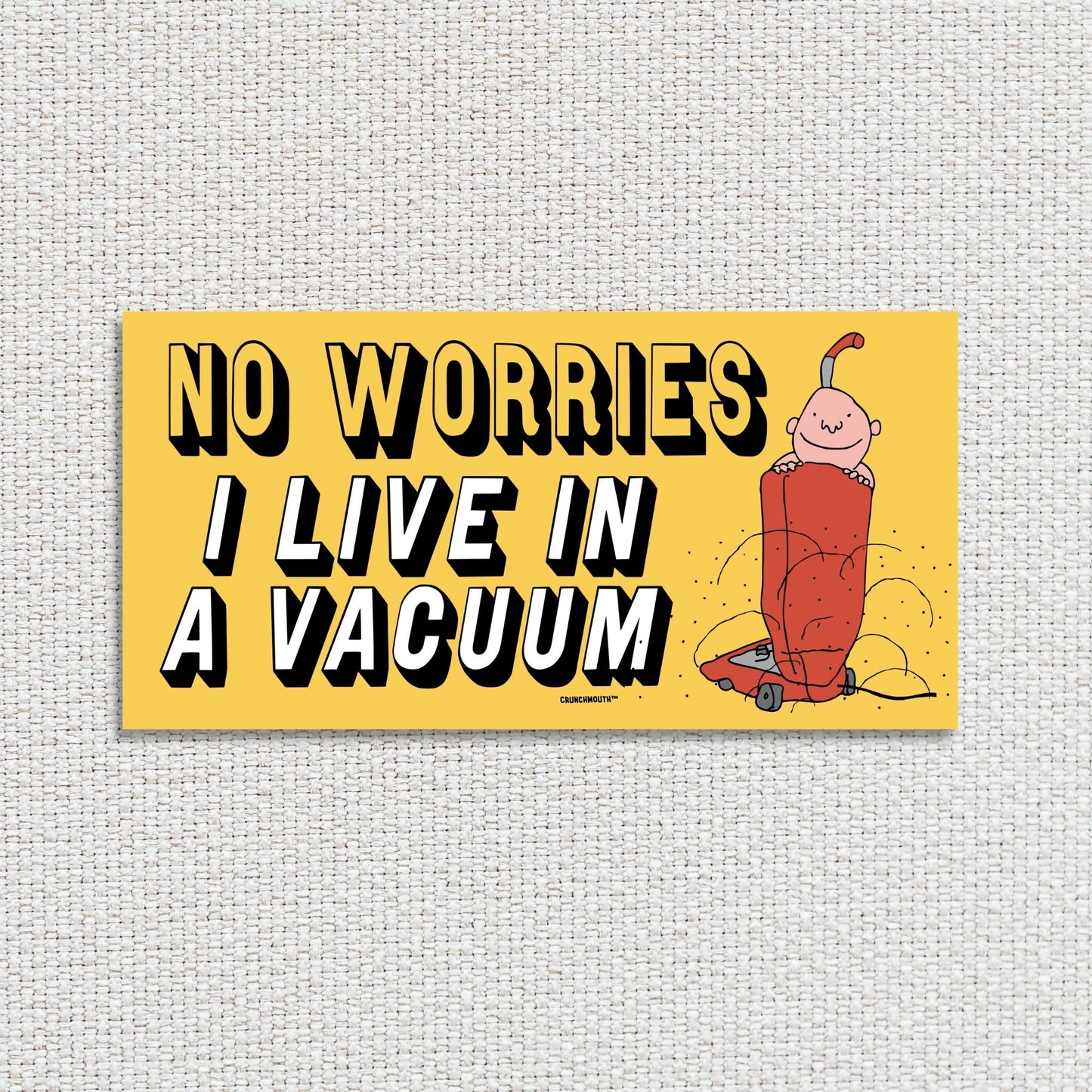 no worries i live in a vacuum bumper sticker, textured fabric background
