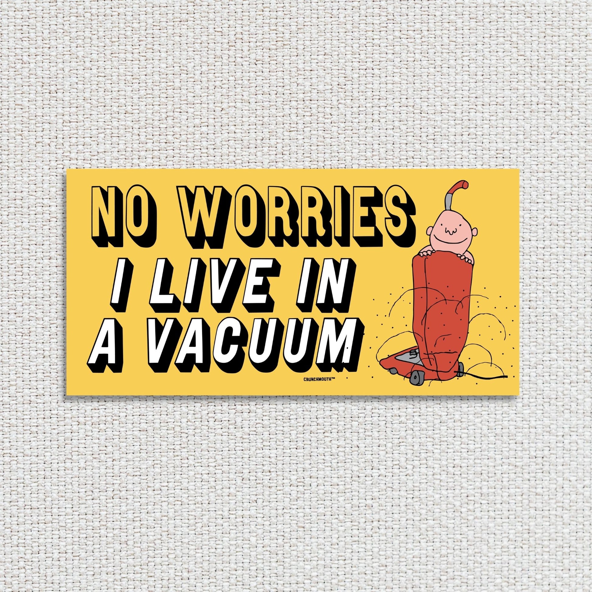 no worries i live in a vacuum bumper sticker, textured fabric background
