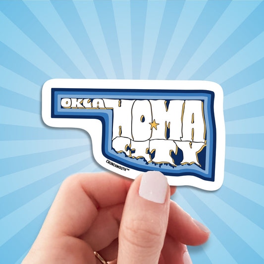 oklahoma city travel luggage sticker, hand display, sun rays design background