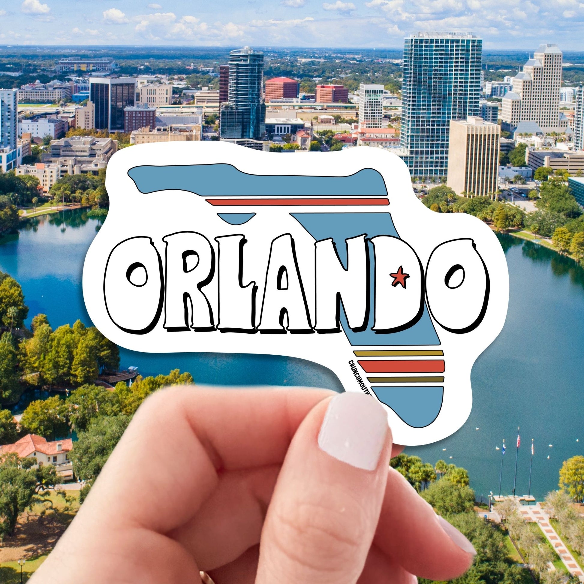 orlando travel luggage sticker, hand display, Orlando cityscape background
