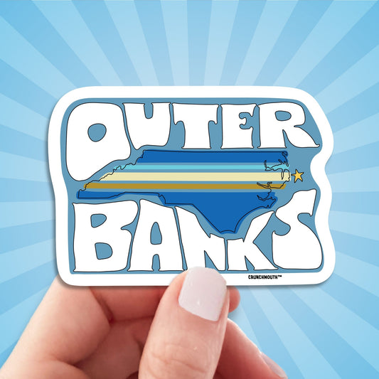 outer banks travel luggage sticker, hand display, sun rays design background
