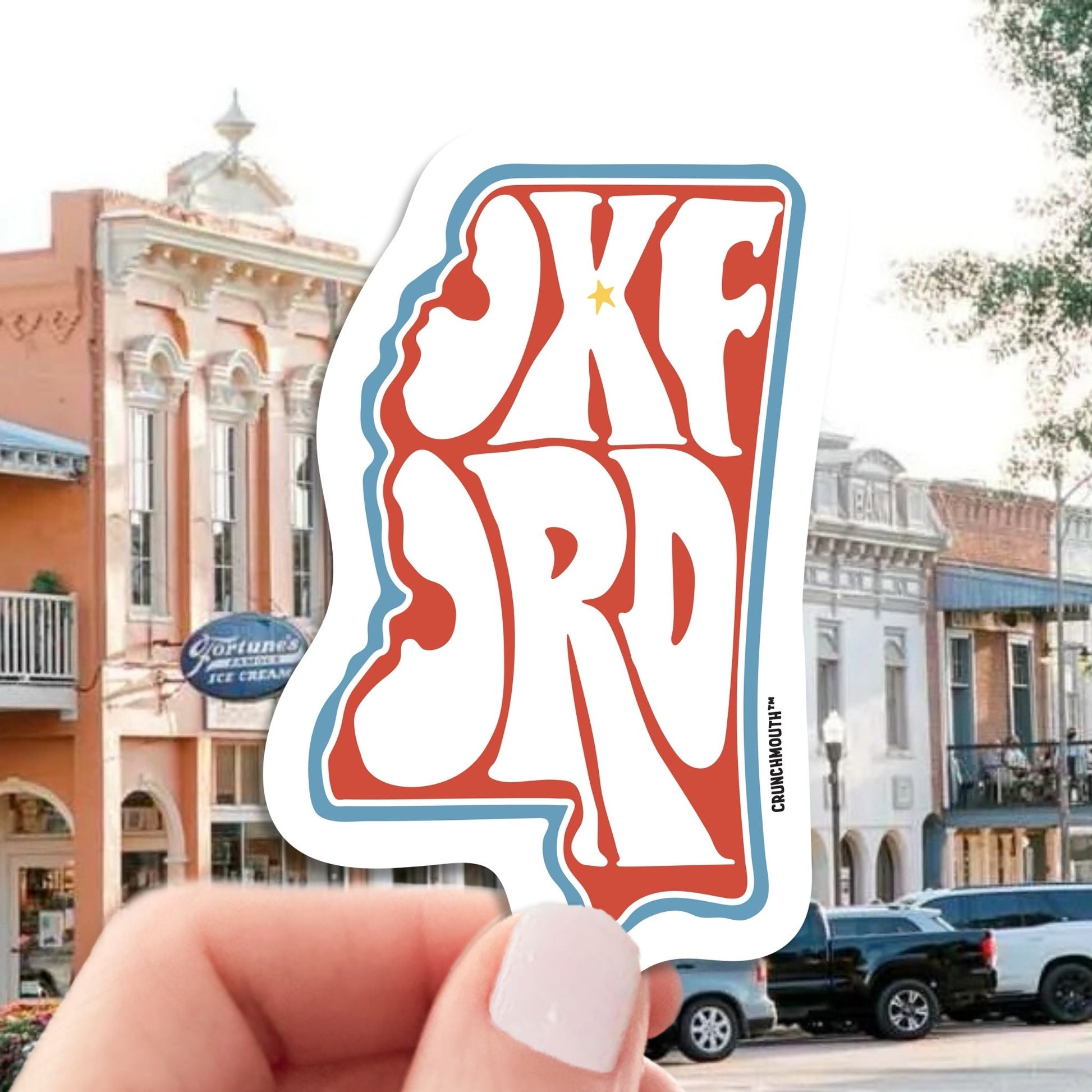 oxford mississippi travel luggage sticker, hand display, town background