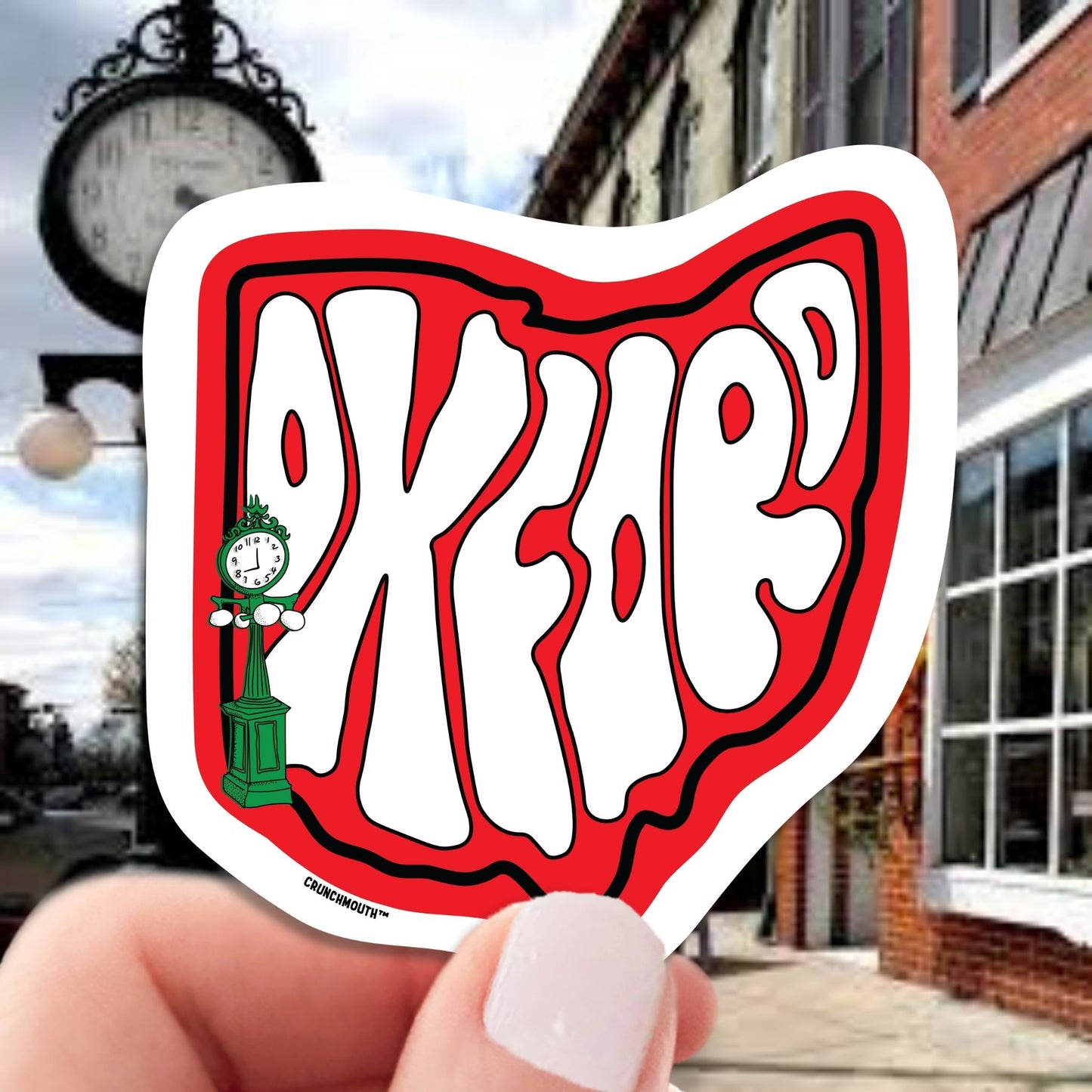 OXFORD travel luggage sticker, hand display, MAIN STREET background
