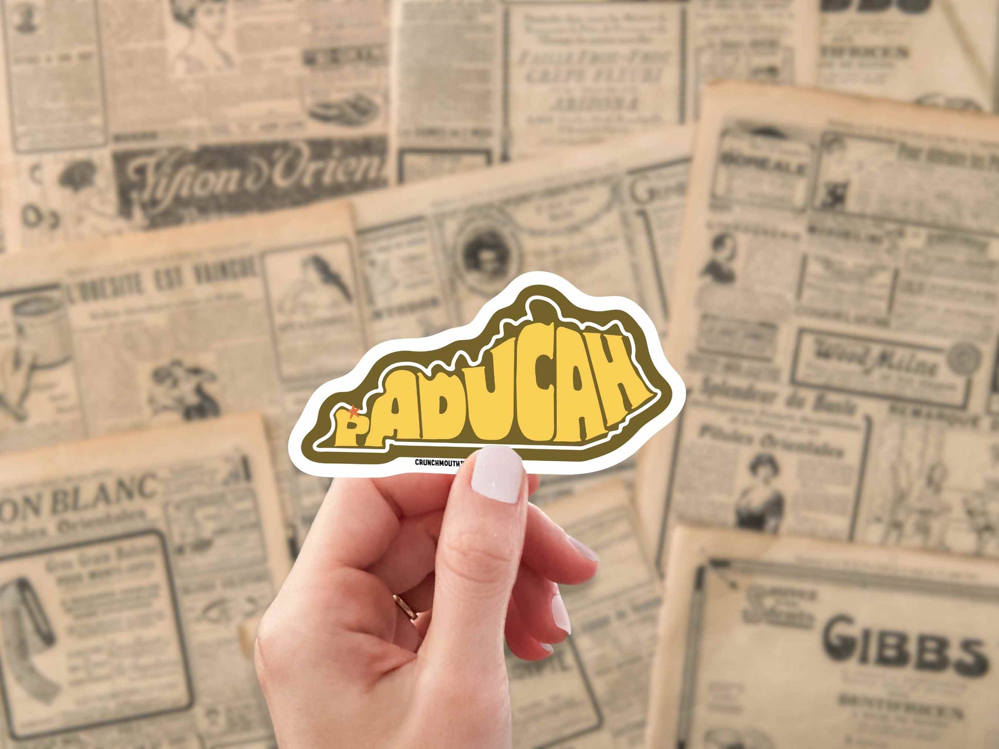 paducah kentucky travel luggage sticker, hand display, antique newspaper ads background