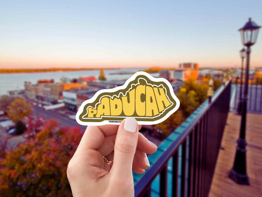 paducah kentucky travel luggage sticker, hand display, paducah cityscape background