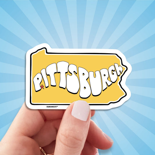 pittsburgh travel luggage sticker, hand display, sun rays design background
