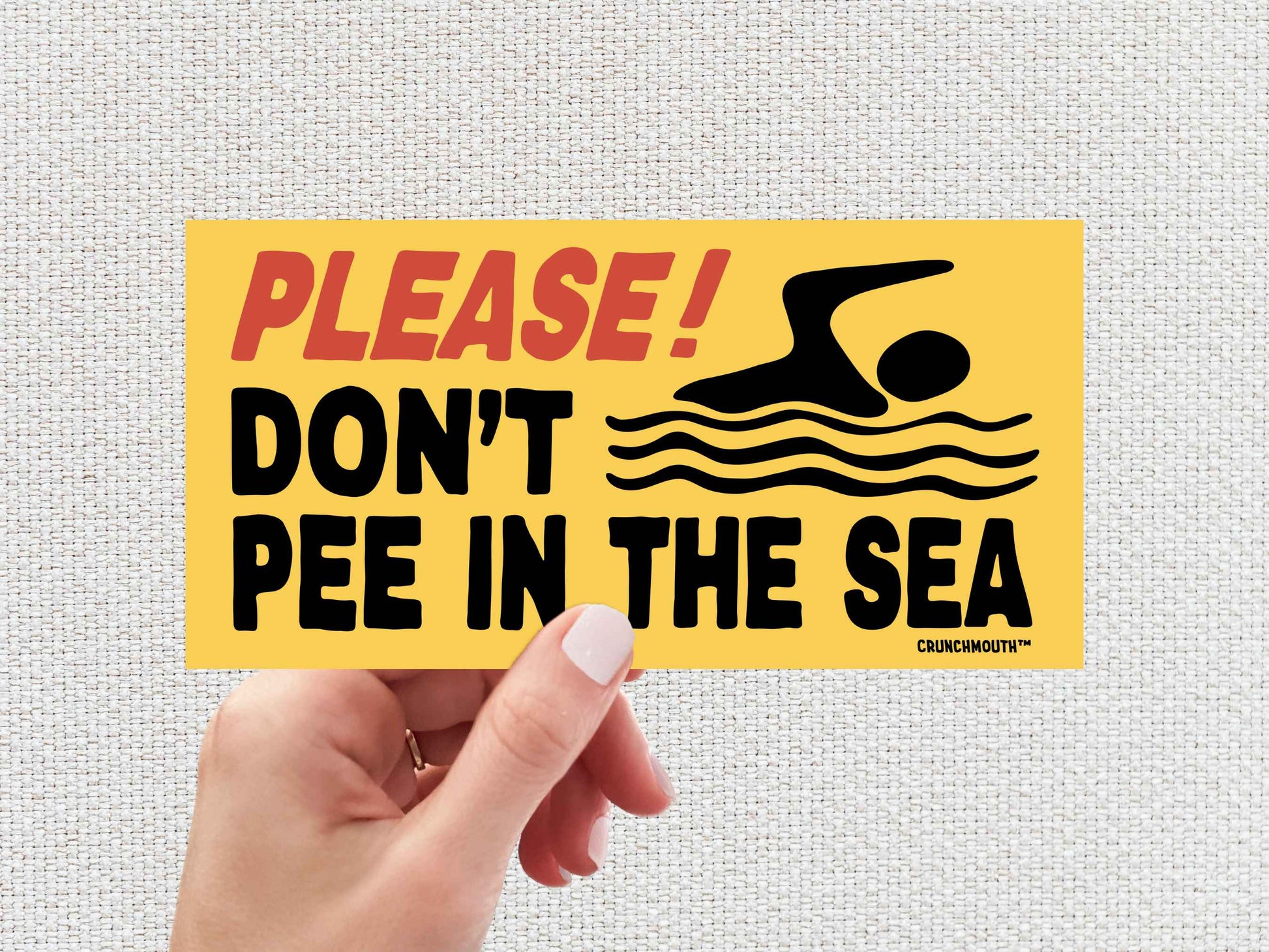 please dont pee in the sea bumper sticker, funny bumper stickers, hand display, white textured background