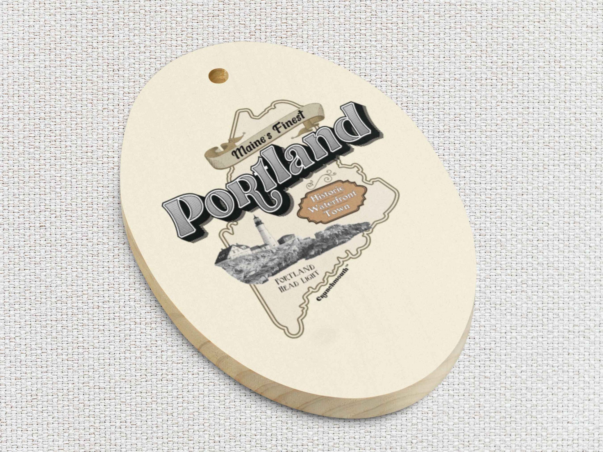 portland maine Christmas ornament, front bottom left side, white textured background