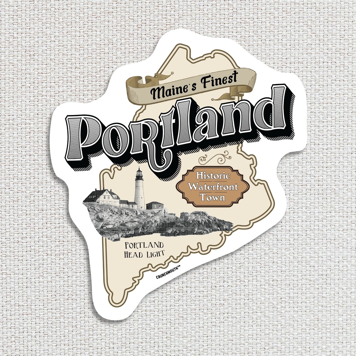 portland maine travel luggage sticker, hand display, textured fabric background
