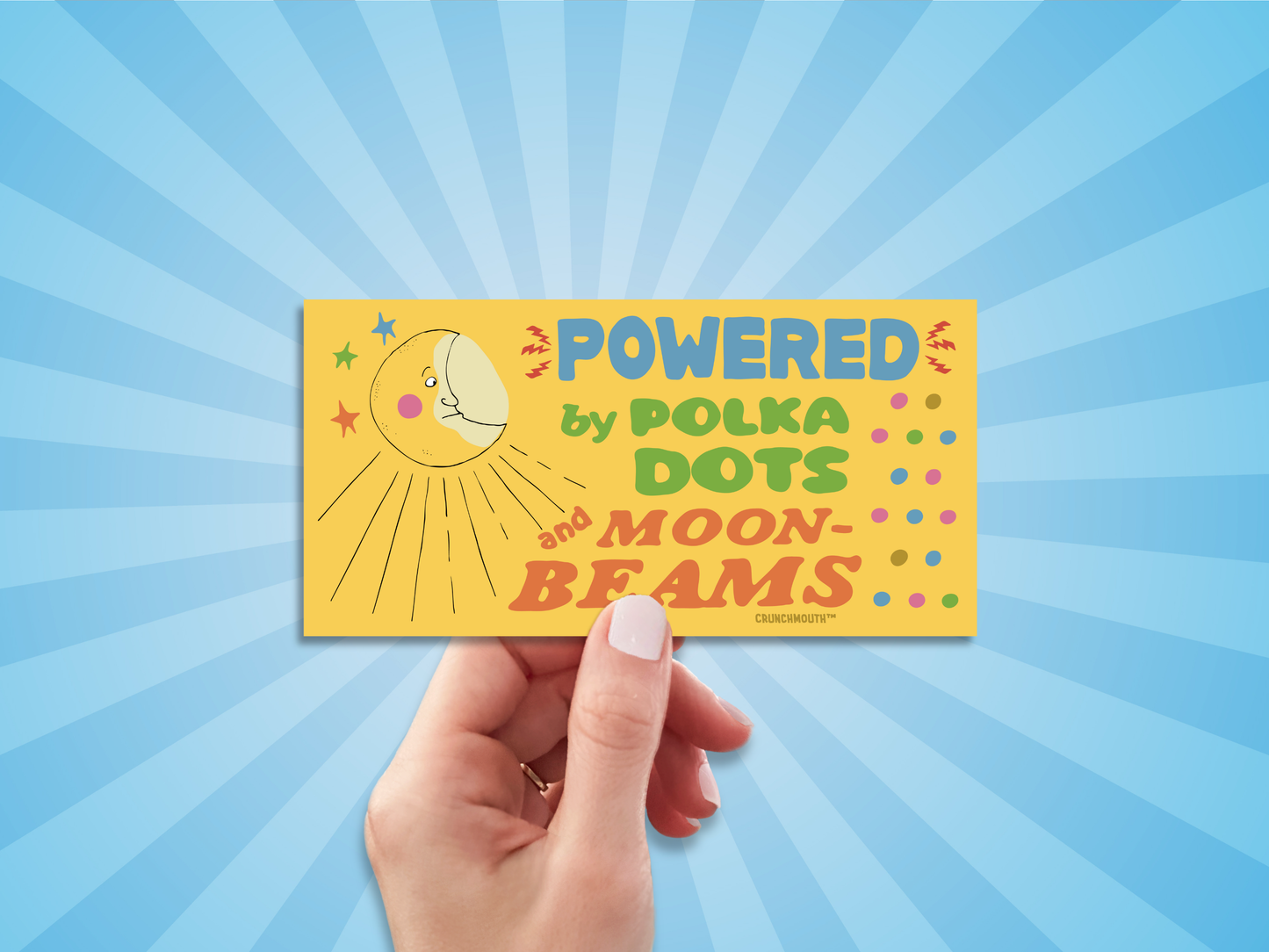 powered by polka dots and moonbeams bumper sticker, hand display, sun rays design background