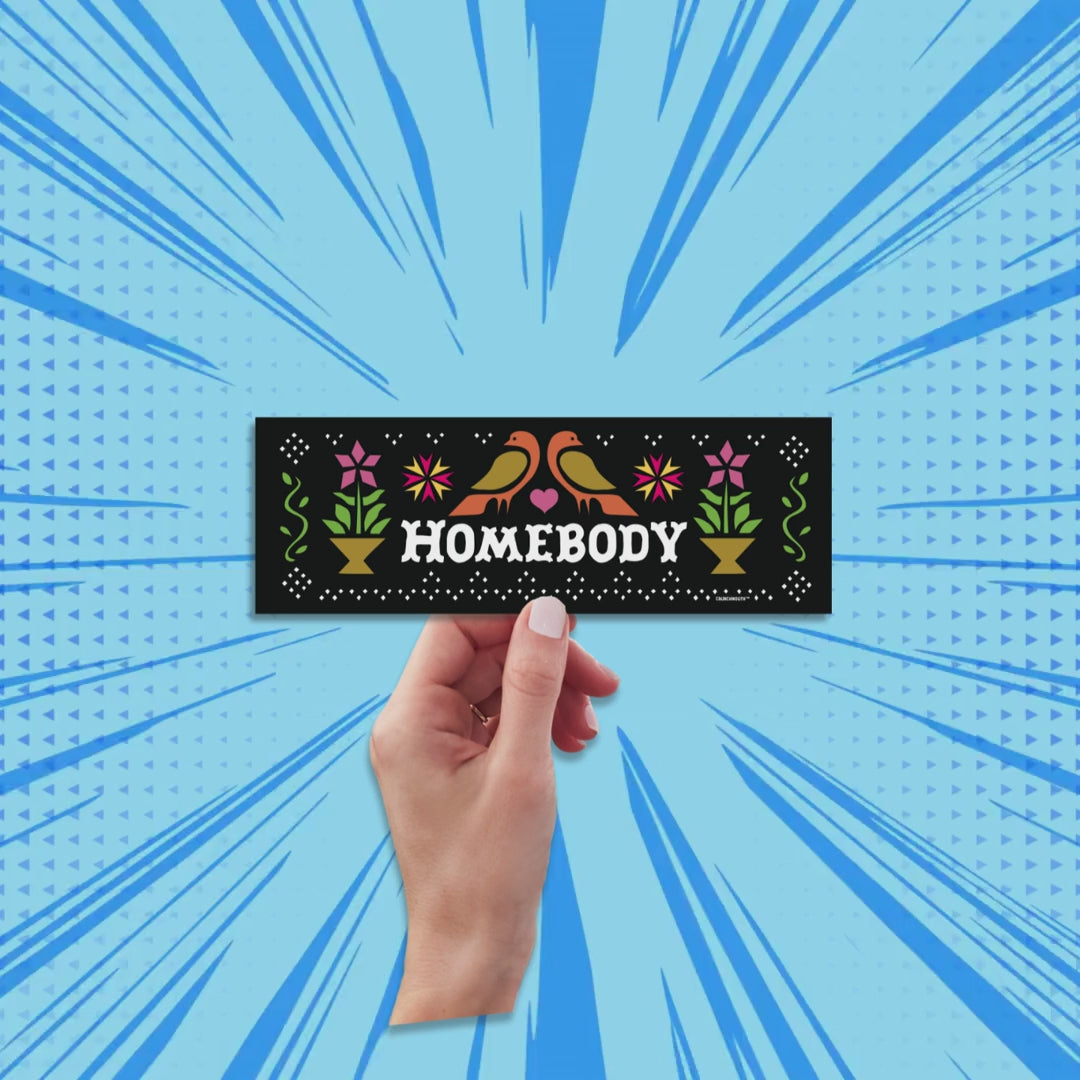 homebody bumper sticker, hand display, sun rays design background