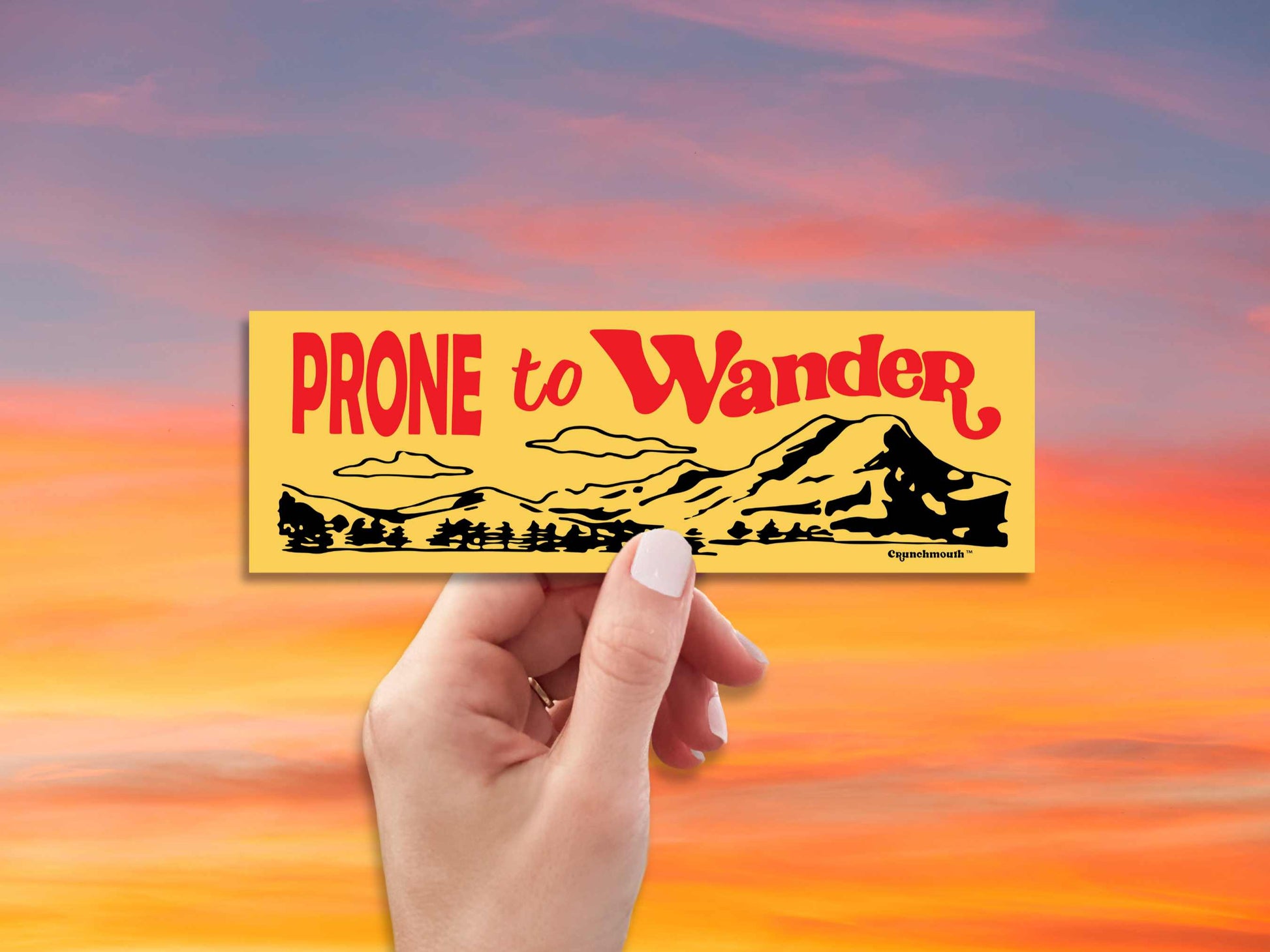 prone to wander bumper sticker, yellow, hand display, red sky background