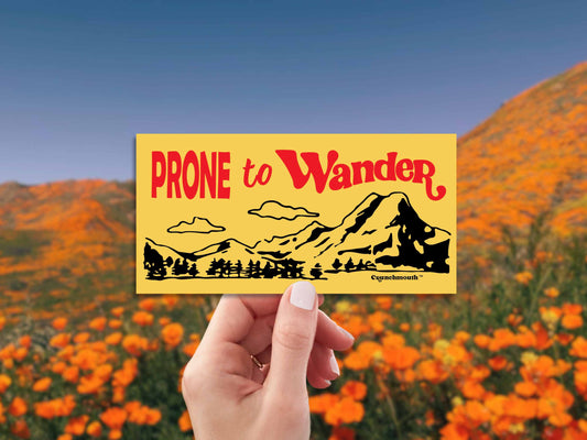 prone to wander bumper sticker, hand display, california poppies background