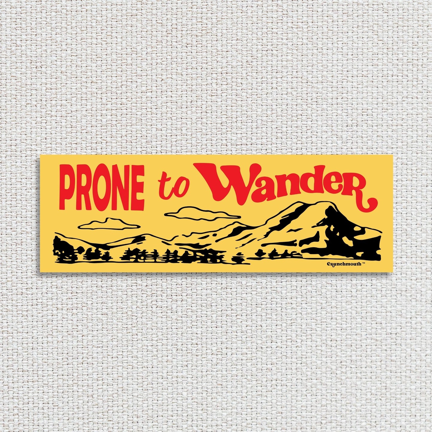 prone to wander bumper sticker, yellow color, textured fabric background