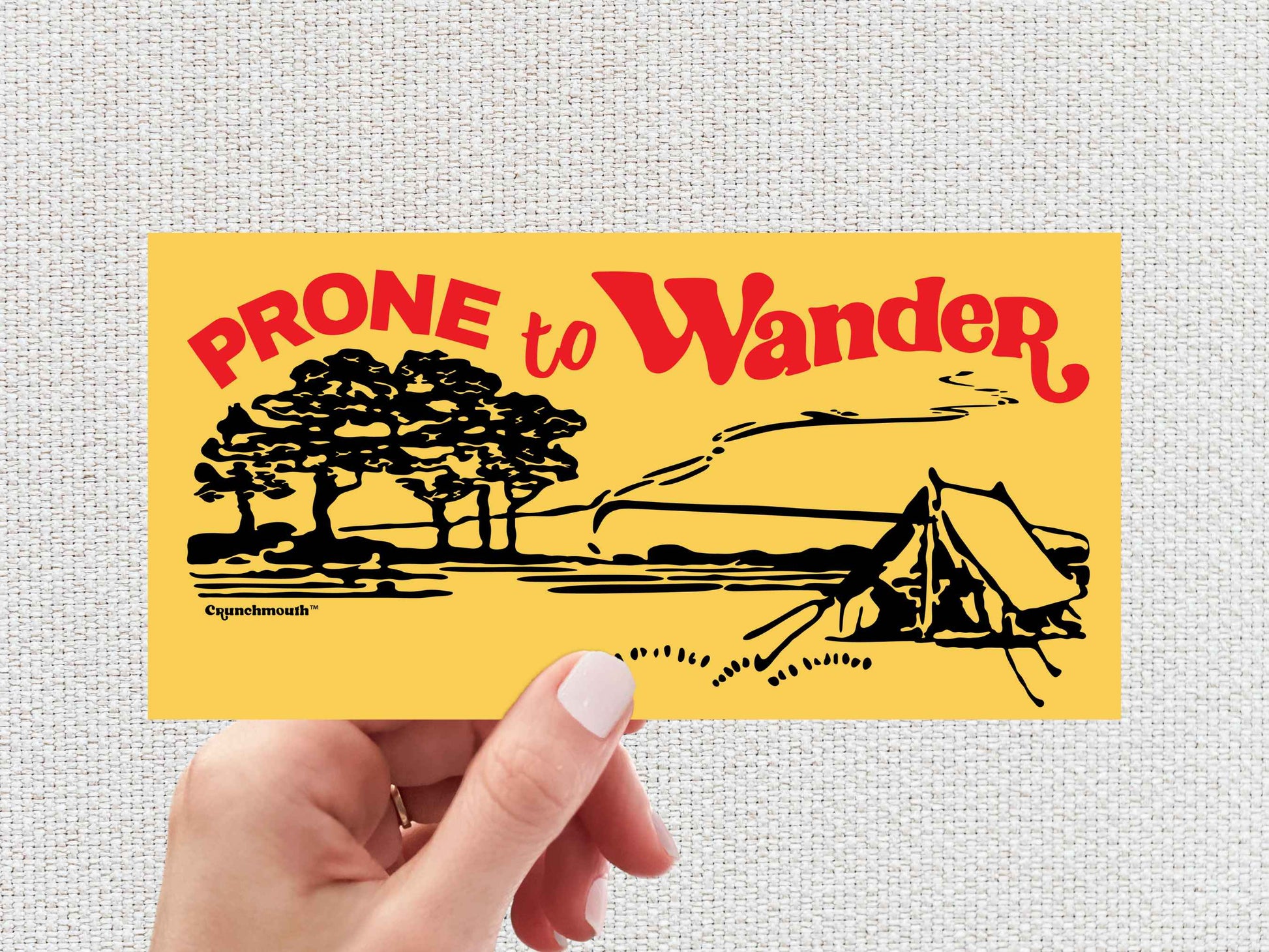 prone to wander bumper sticker, tent camping, hand display, white textured background