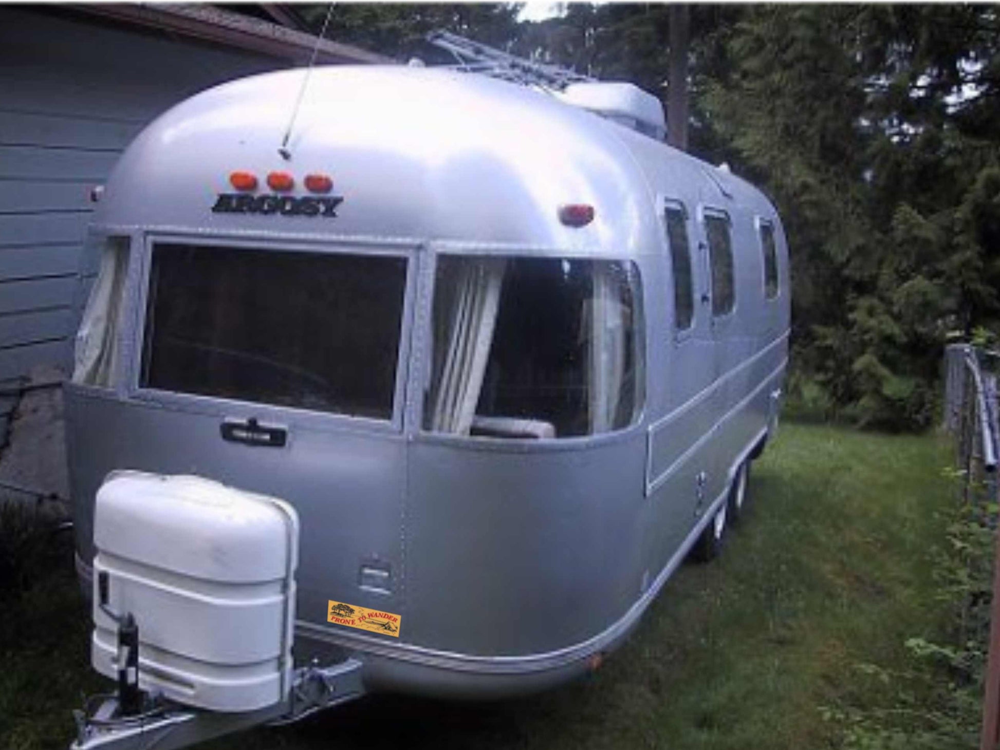 prone to wander camping bumper sticker, displayed on airstream camper