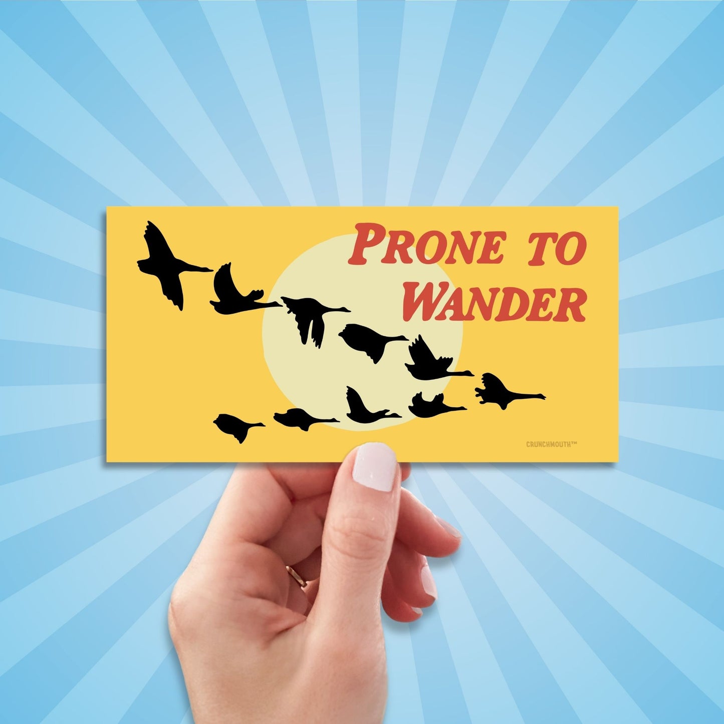 prone to wander Canada geese bumper sticker, hand display, sun rays design background
