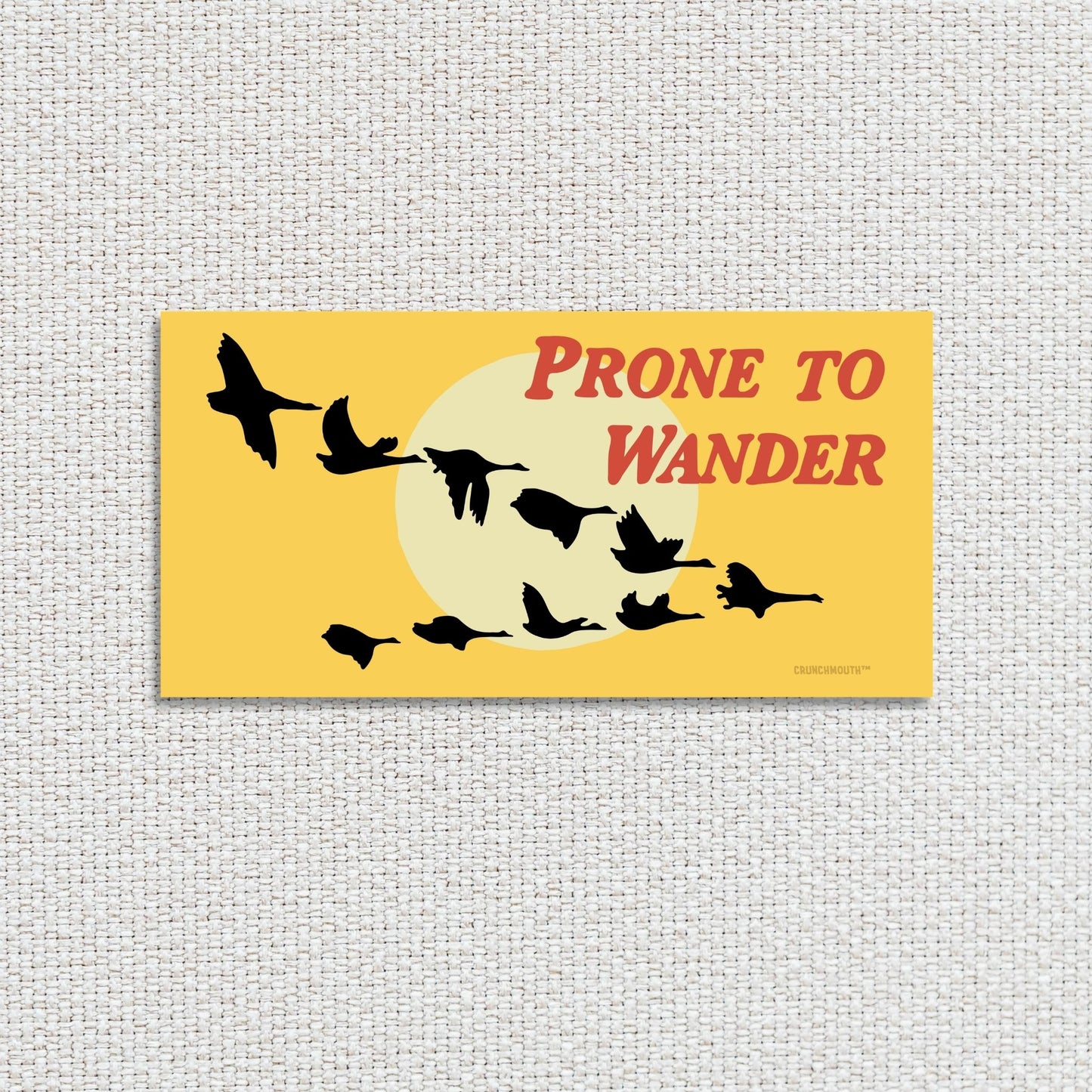 prone to wander Canada geese bumper sticker, textured fabric background
