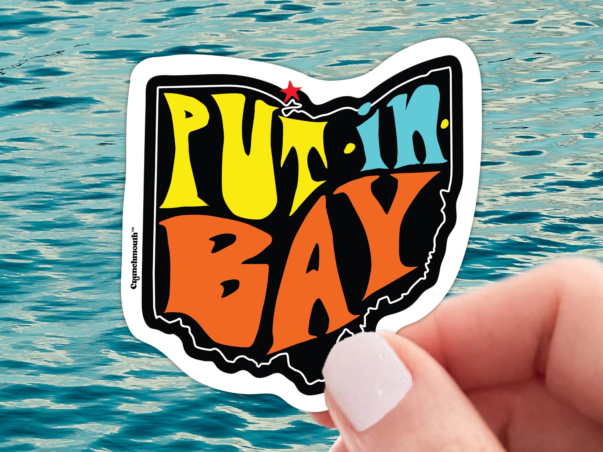 put in bay ohio vinyl sticker, hand display, blue ocean water background