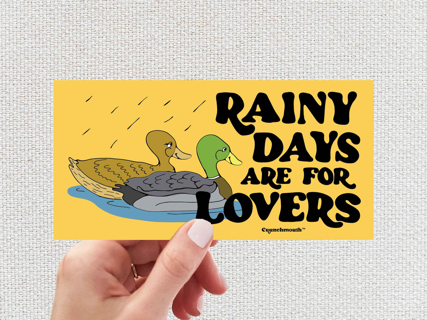 rainy days are for lovers, mallard duck bumper sticker, hand display, white textured background