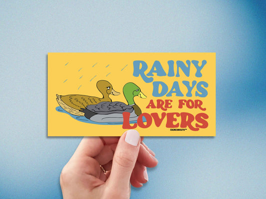 rainy days are for lovers mallard duck bumper sticker, hand display, grainy blue gradient background