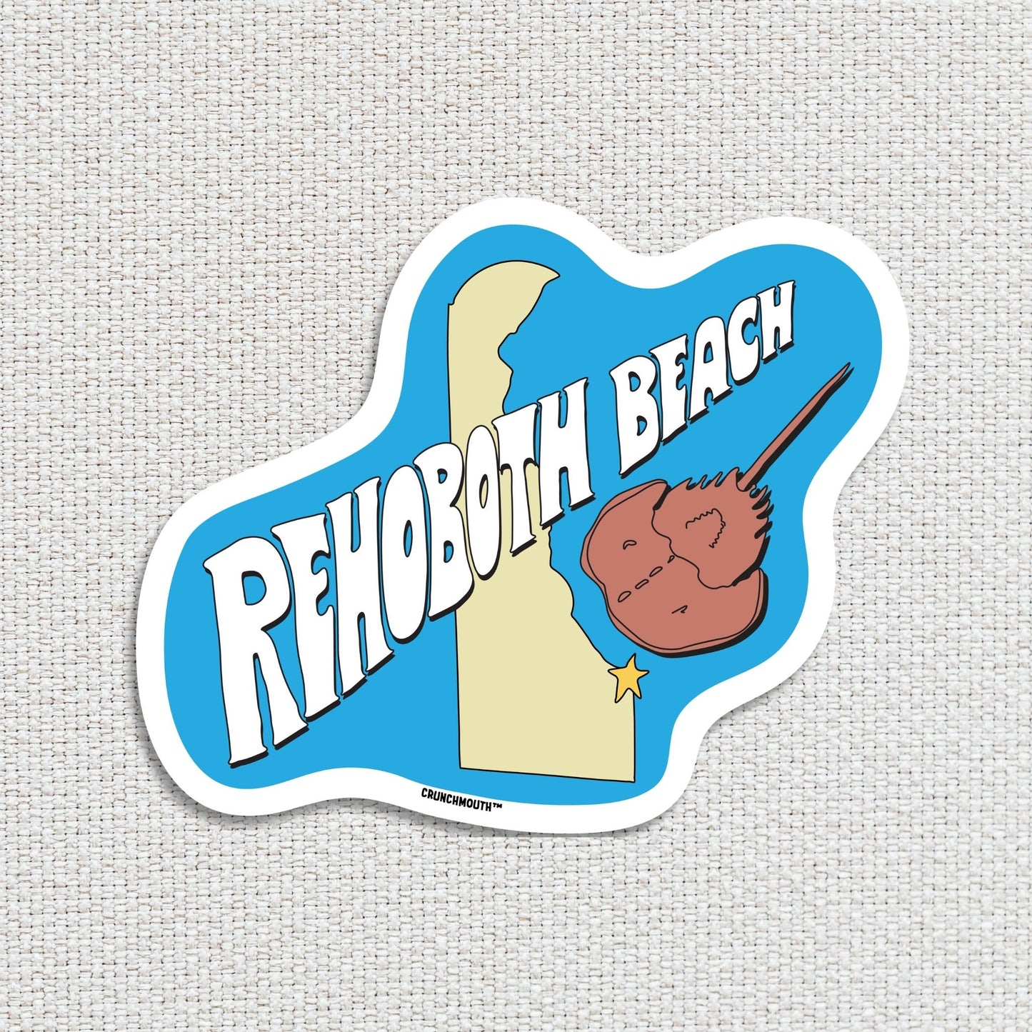 Rehoboth beach travel luggage sticker, textured fabric background
