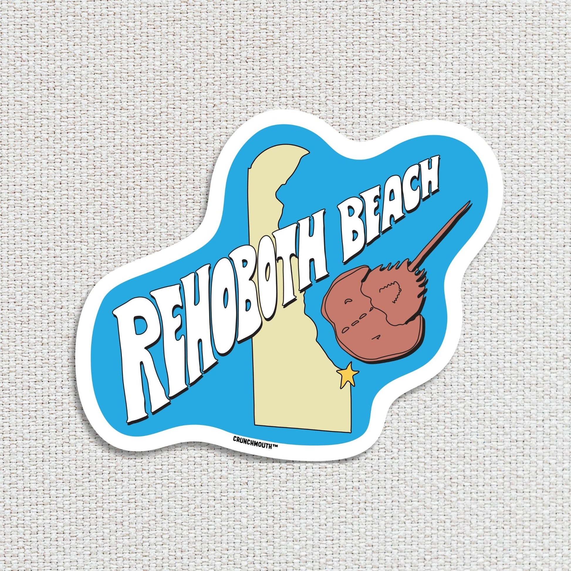 Rehoboth beach travel luggage sticker, textured fabric background
