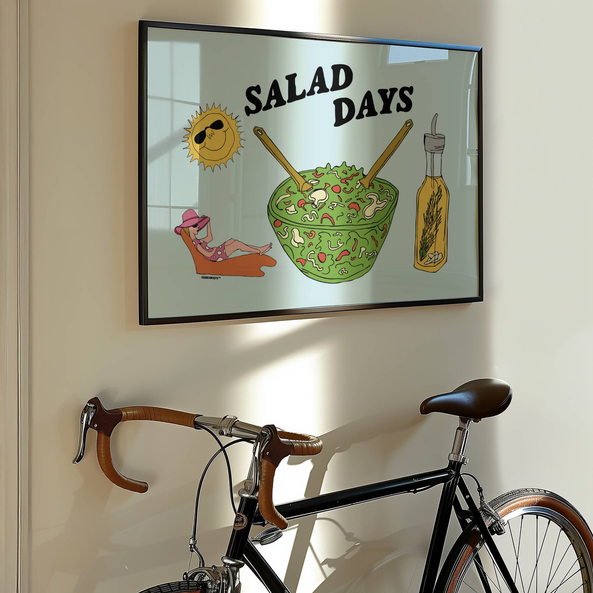 salad days wall art, displayed in in context in home, hanging on wall above bicycle