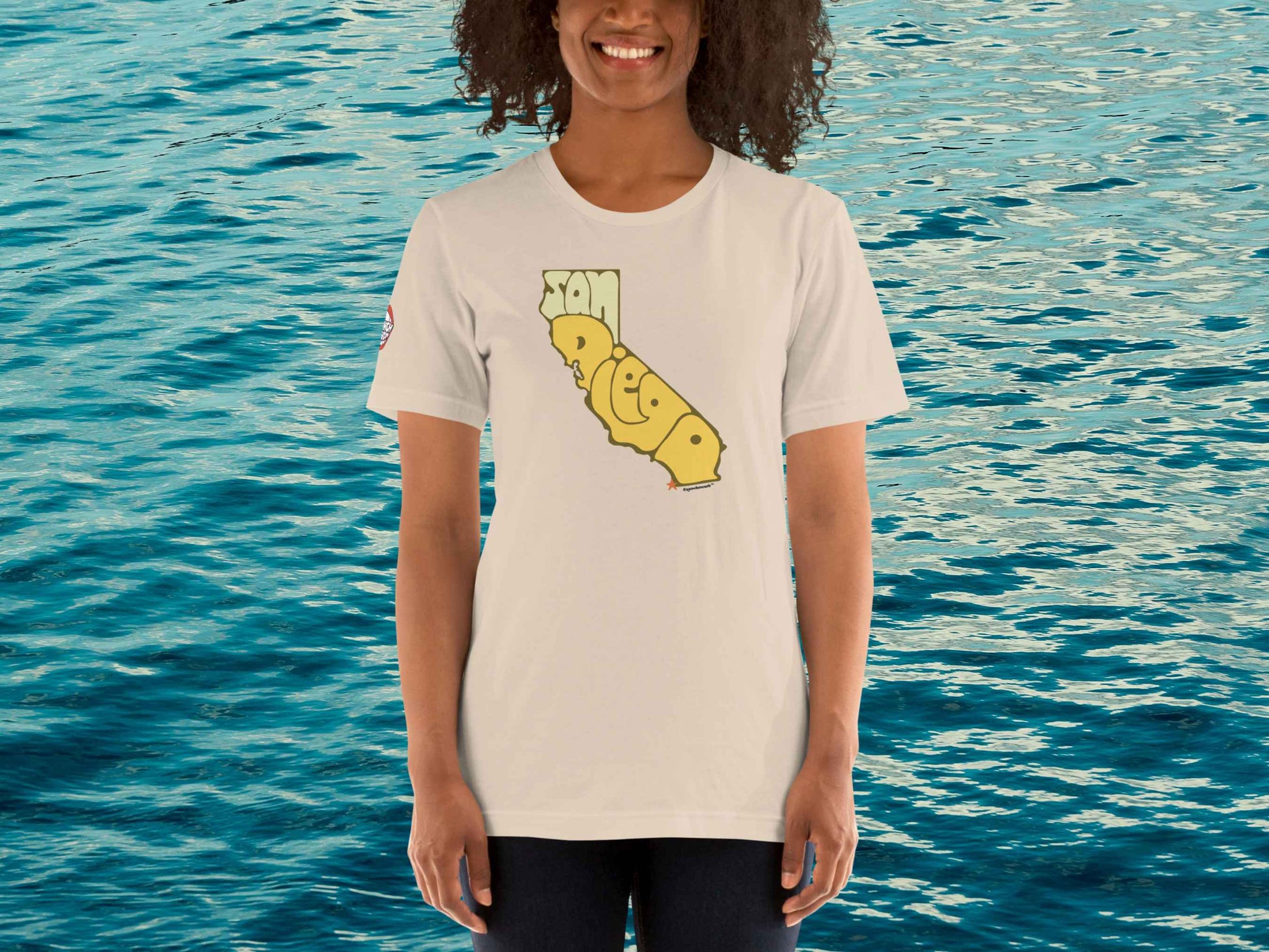 san diego shirt, retro t shirts, female model, front, blue ocean background