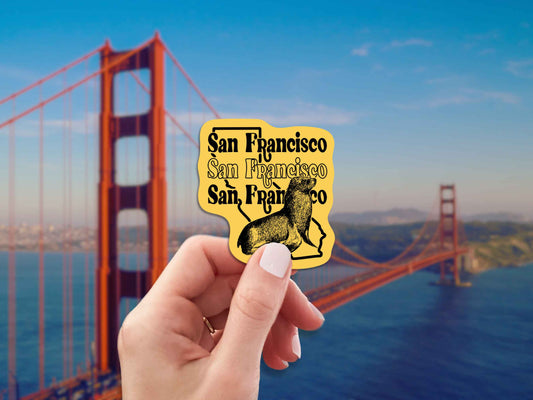 san francisco travel luggage sticker, hand display, blurred landscape background