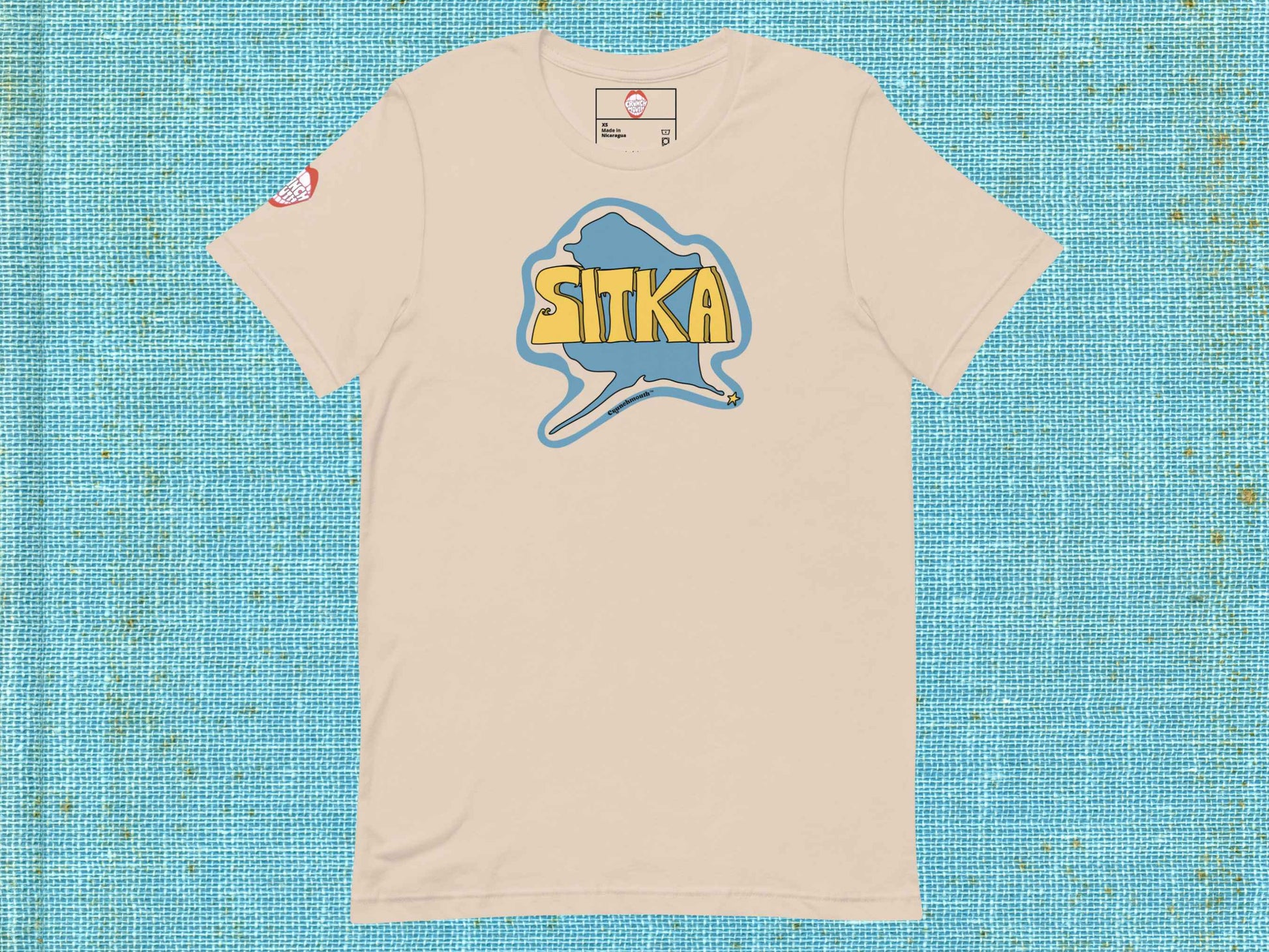 sitka shirt, souvenir t shirts, flat, front, blue textured background