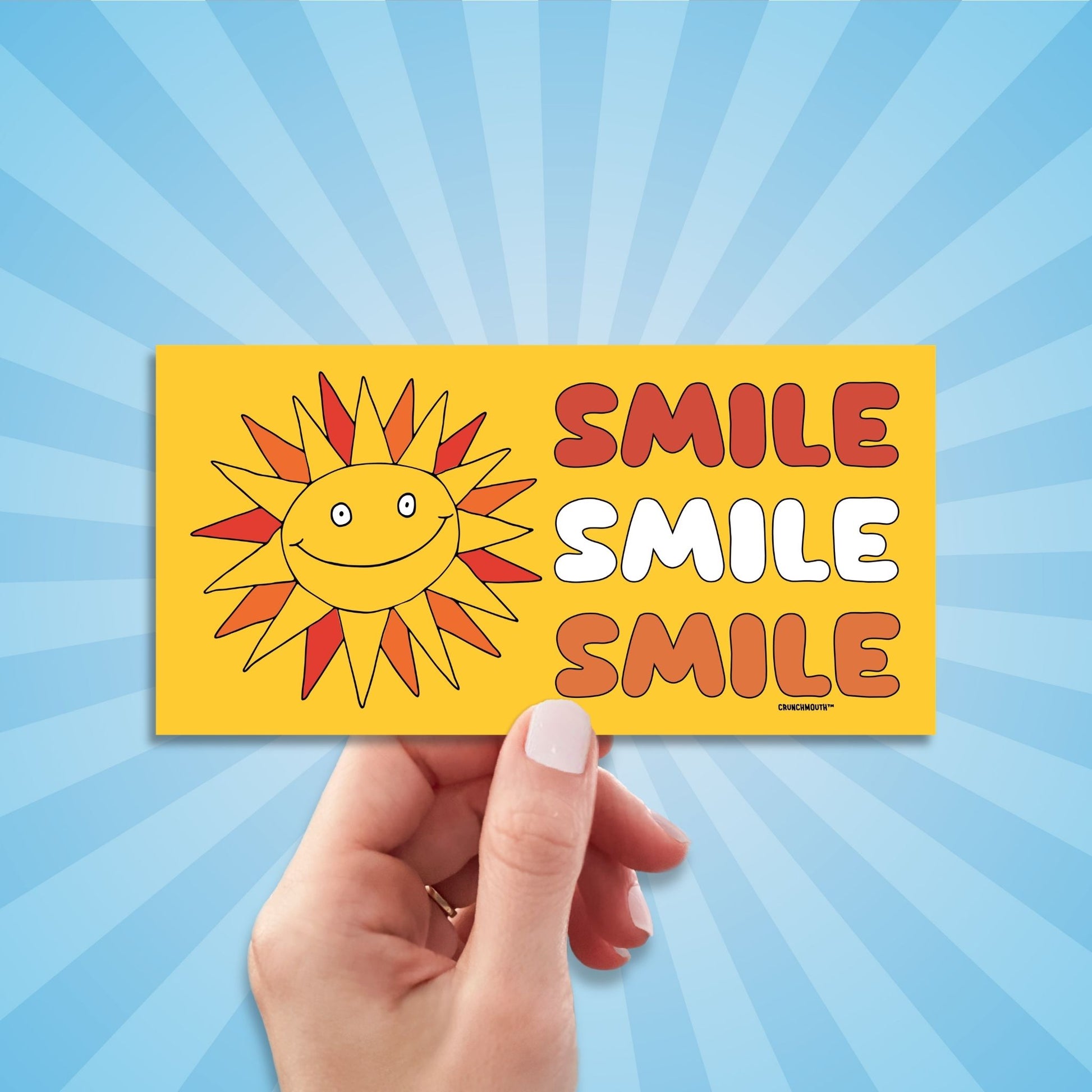 smile smile smile bumper sticker, very bad intentions, hand display, sun rays design background
